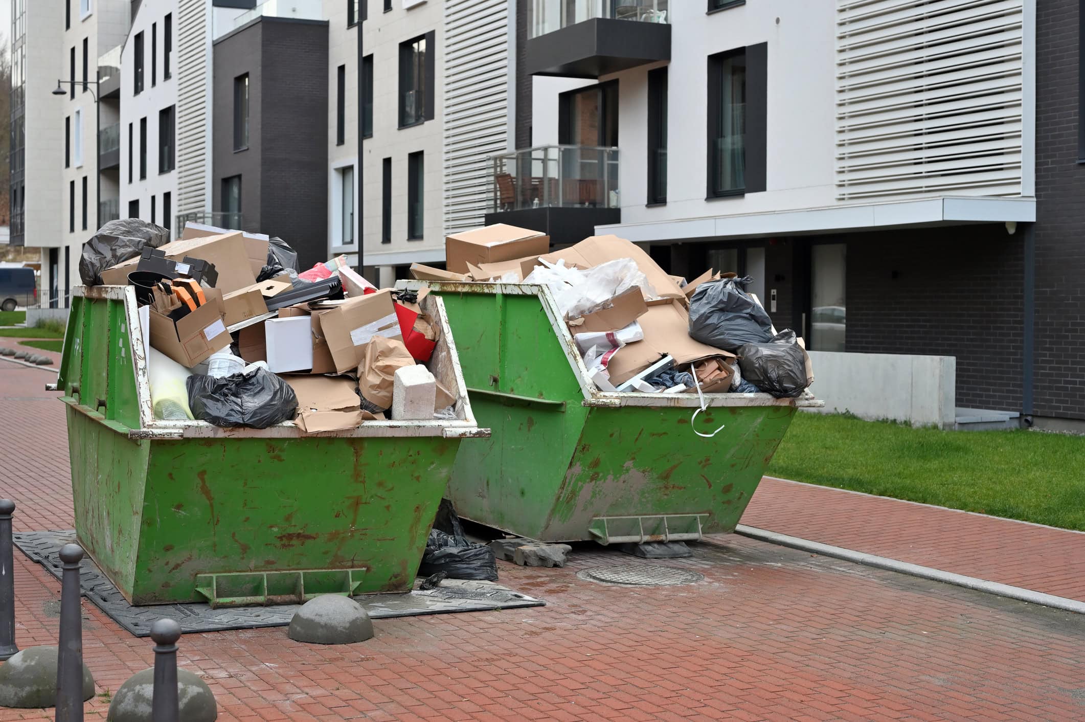 Skip on driveway in Derbyshire with calendar overlay showing 14 days
